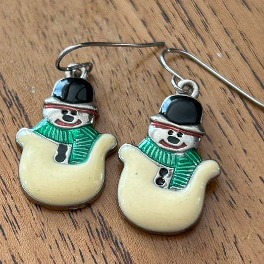 Novelty Christmas Earrings. Cute smiley snowman. Cream and green enamel on silver tone metal.. For pierced ears.