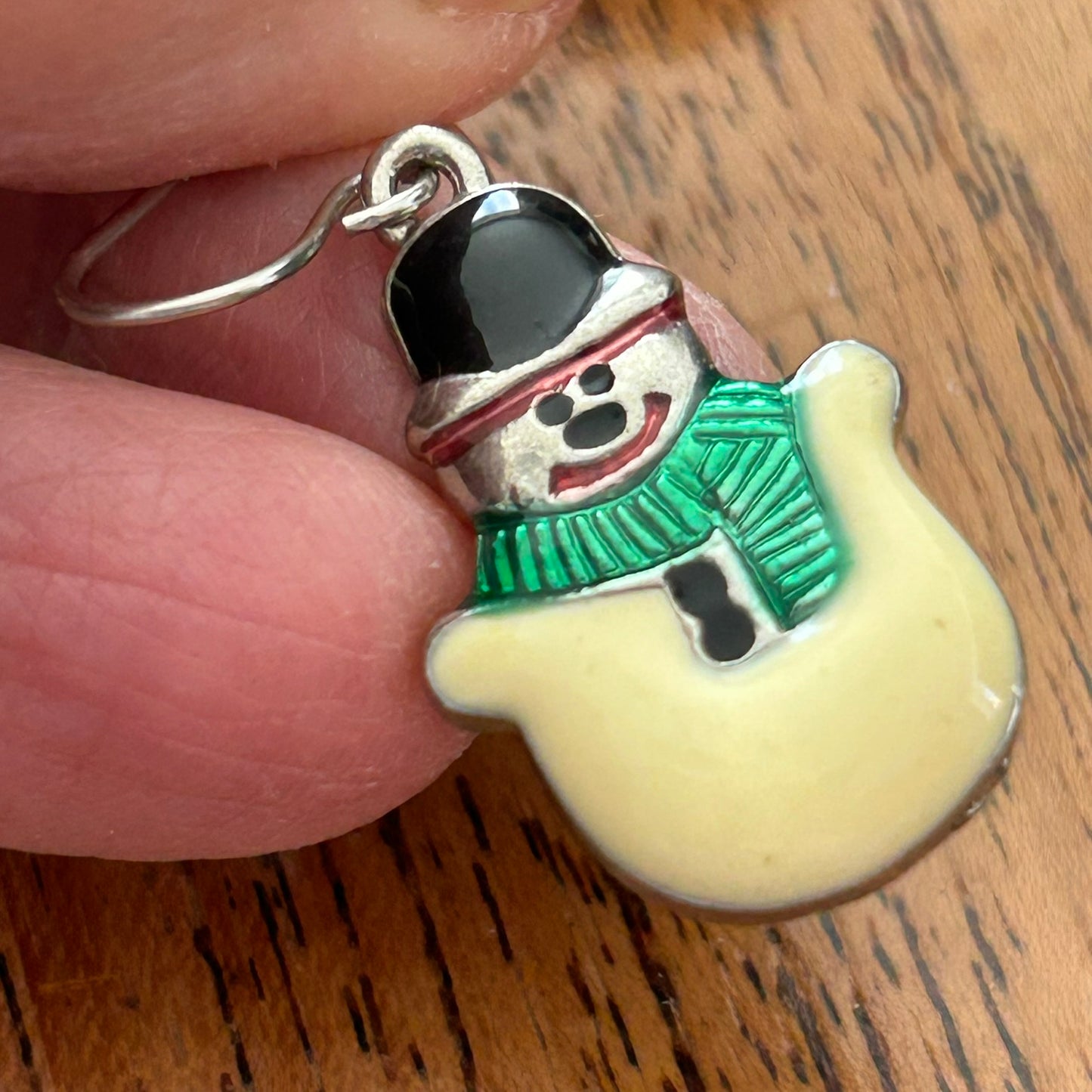 Novelty Christmas Earrings. Cute smiley snowman. Cream and green enamel on silver tone metal.. For pierced ears.