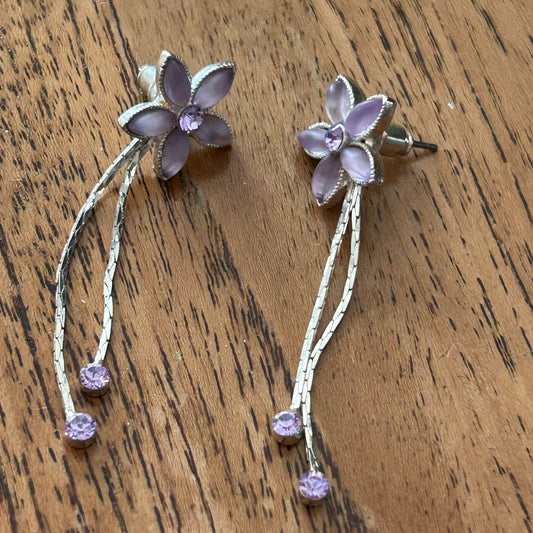 Pretty Silver Tone Drop Earrings. With Pale Pinky Purple stones. Flower shape with silver dangly pieces.