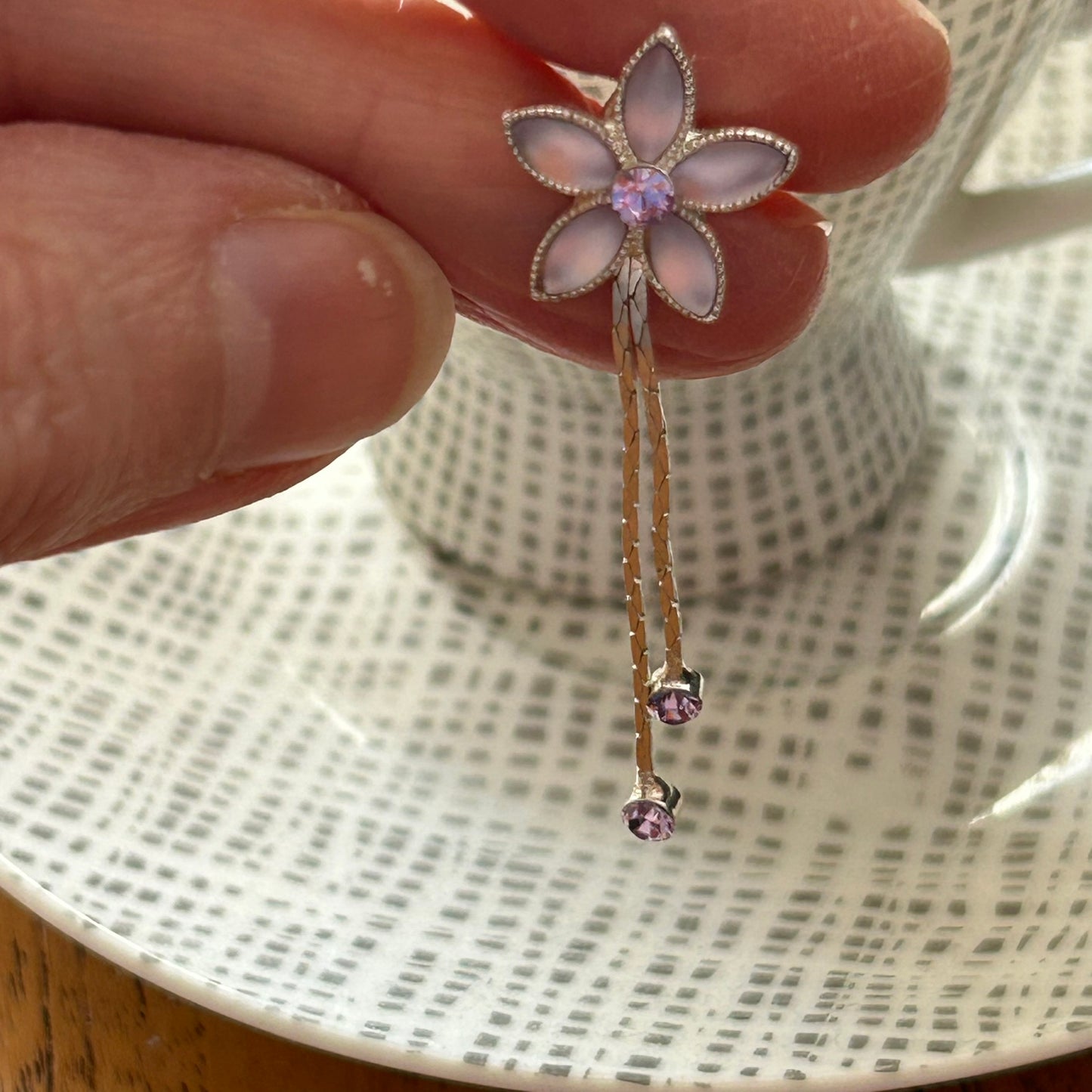 Pretty Silver Tone Drop Earrings. With Pale Pinky Purple stones. Flower shape with silver dangly pieces.