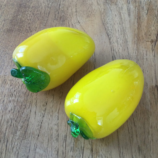 Pair of bright yellow and green art glass pepper ornaments / paperweights. Glass salad vegetables.