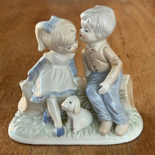 Cute vintage porcelain figurine - Girl and boy on log with puppy - First love - First kiss - Possibly Korean / Japanese