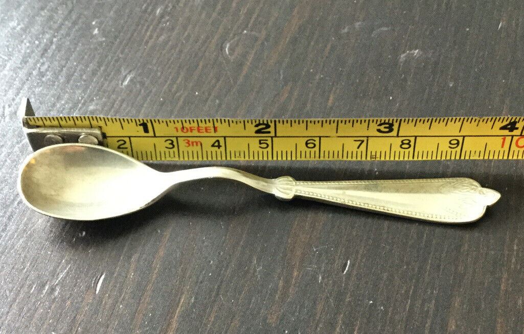 Pretty little vintage silver plated mustard spoon. Afghan F.W Silver. Approx 4" long. Fancy edge.