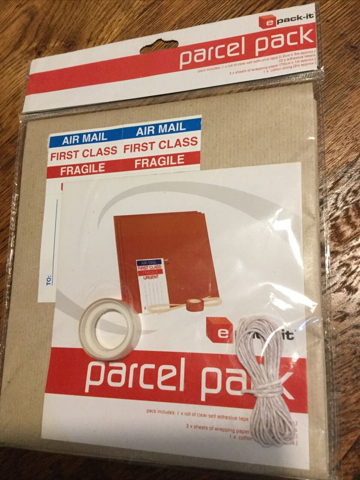 Parcel Pack. Clear Tape, 10 x Adhesive Labels, 3 x Sheets Brown Paper, String