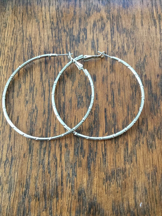 Large Silver Tone Hoop Earrings. Diamond Cut To Catch The Light. Pierced.