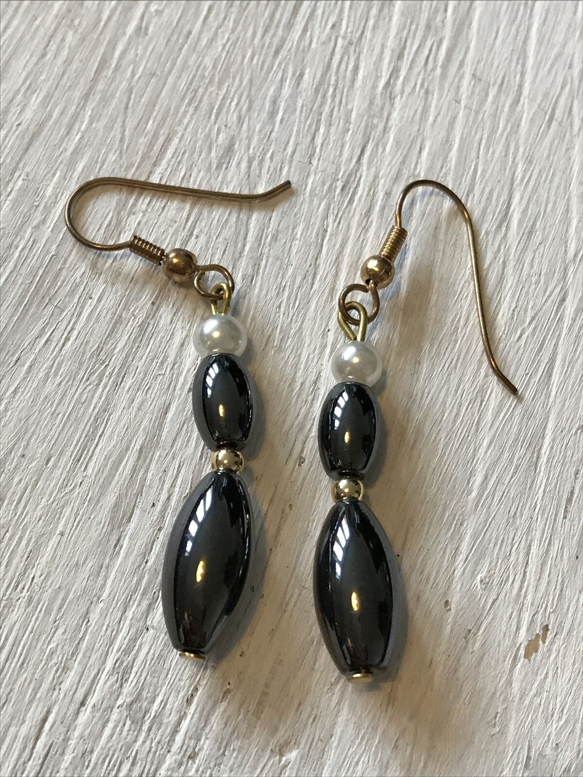 Elegant Drop Earrings. Hematite Simulated Pearl Gold Tone. Simple And Classic. For pierced ears.