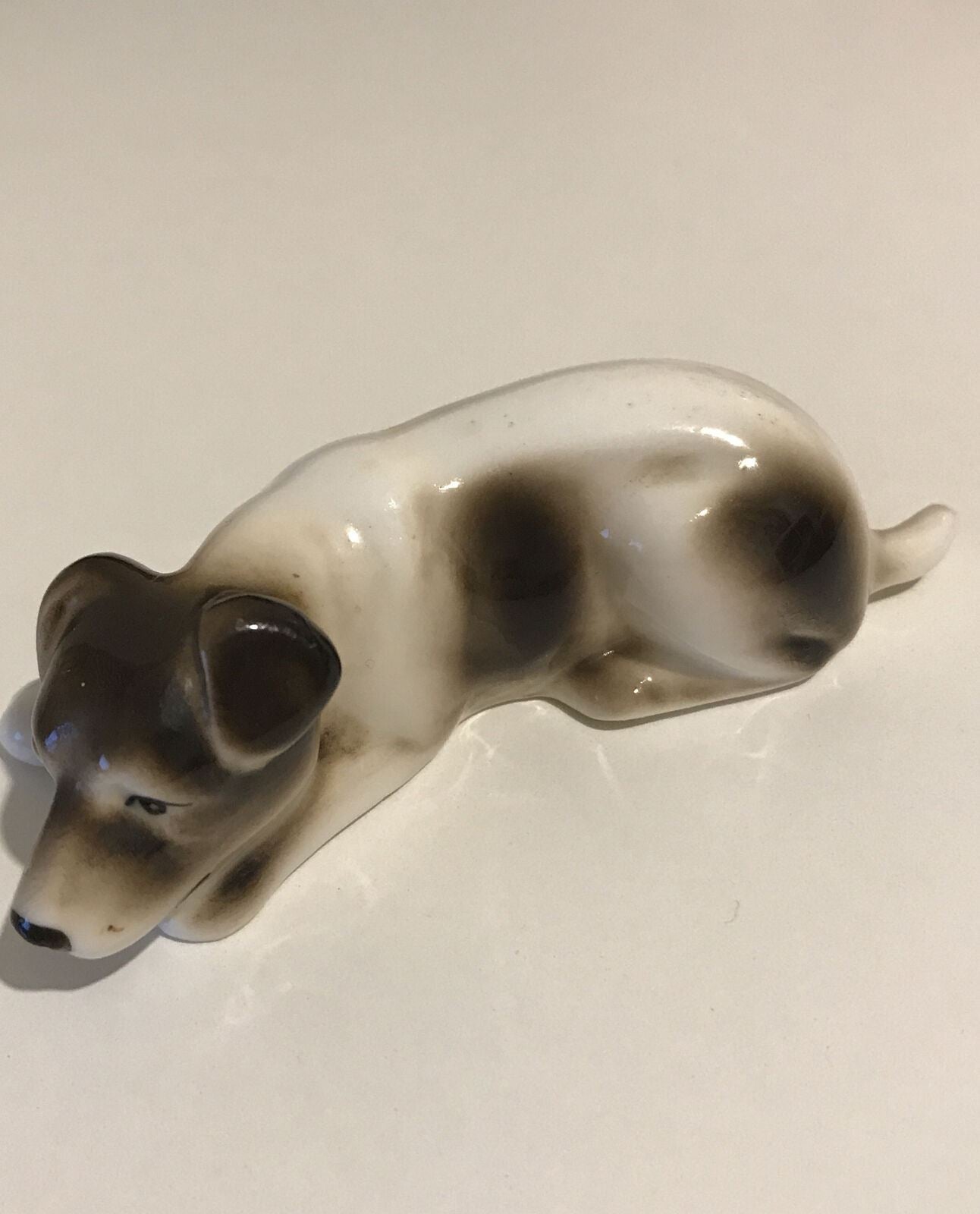 Brown And White Dog Ornament Lying Down. Cute. Miniature. Lovely Face