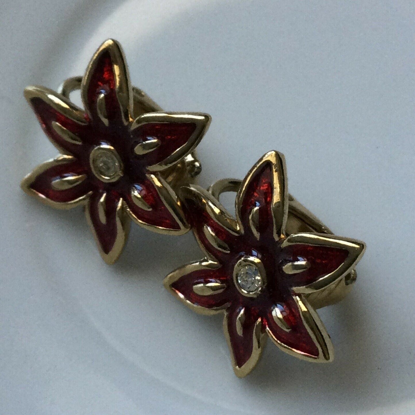 Clip On Earrings Studs. Flower / Star Shape. Gold Tone Red Enamel Diamanté Centr