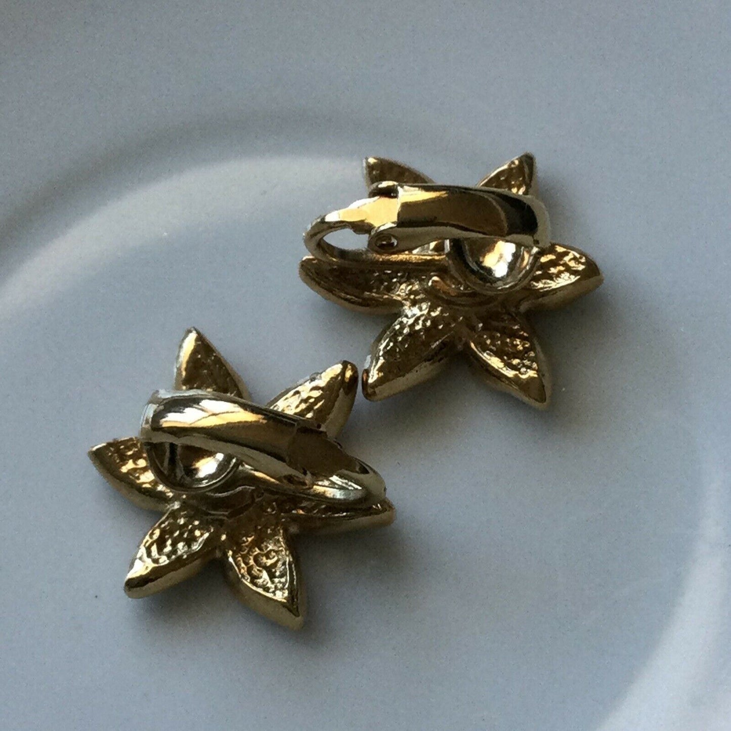 Clip On Earrings Studs. Flower / Star Shape. Gold Tone Red Enamel Diamanté Centr