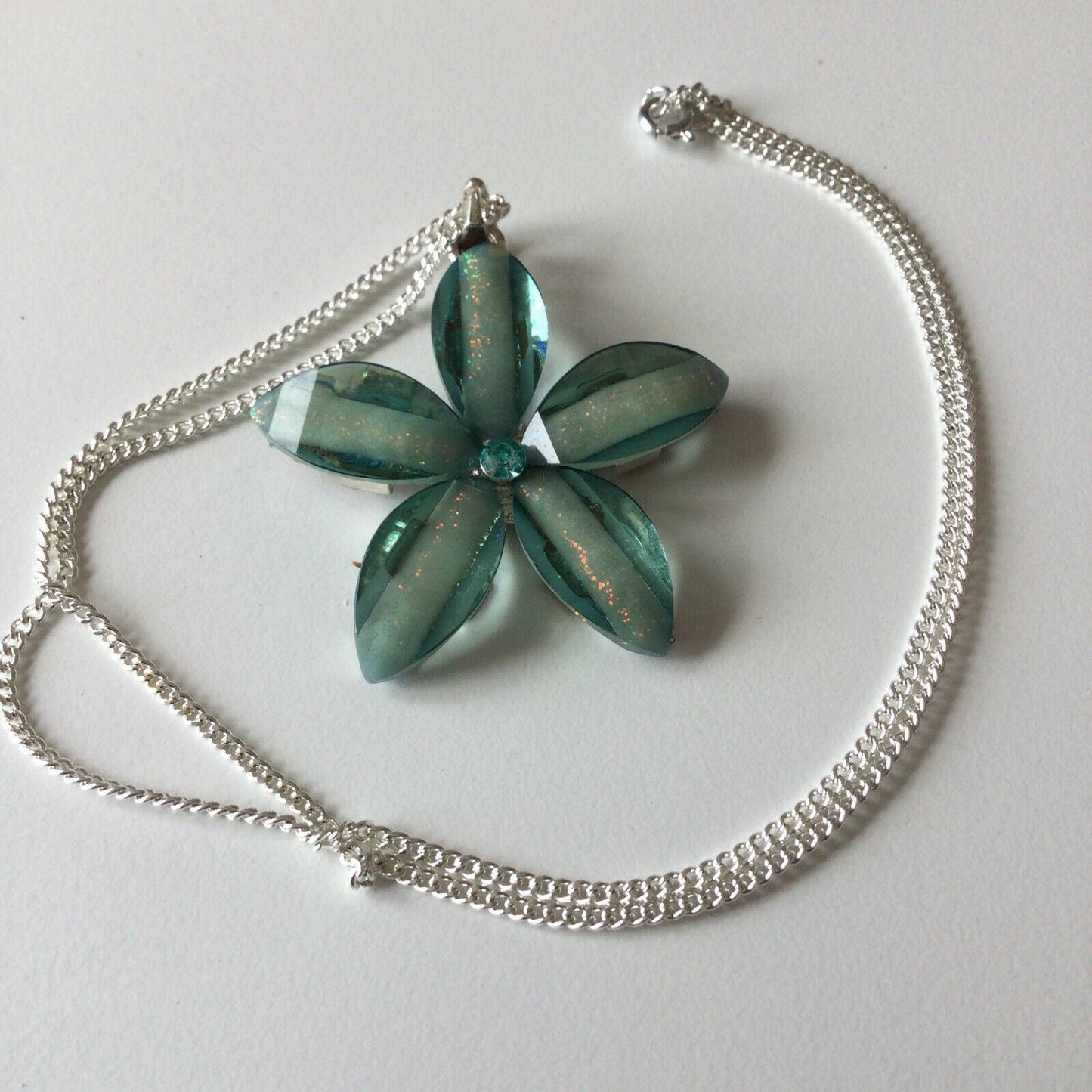 Pretty Aqua Green Flower Style Pendant Chain Plastic With Crystal Centre. Summer