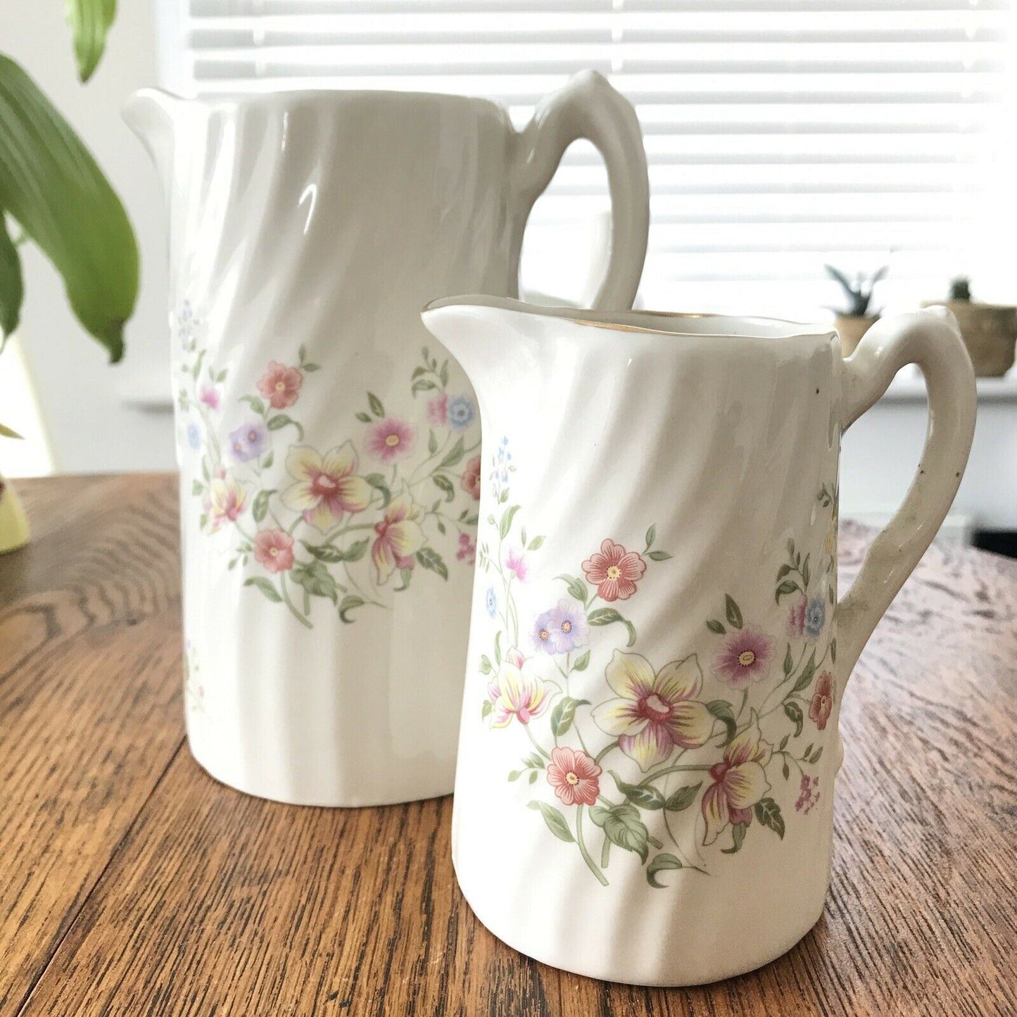 Pair Of Pretty Vintage Floral Jugs. Elegant. White With Pastel Flowers. Textured swirl design.