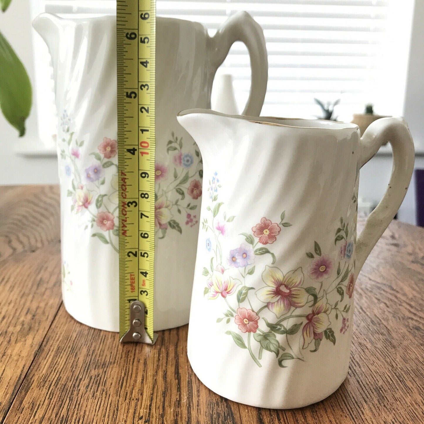 Pair Of Pretty Vintage Floral Jugs. Elegant. White With Pastel Flowers. Textured swirl design.