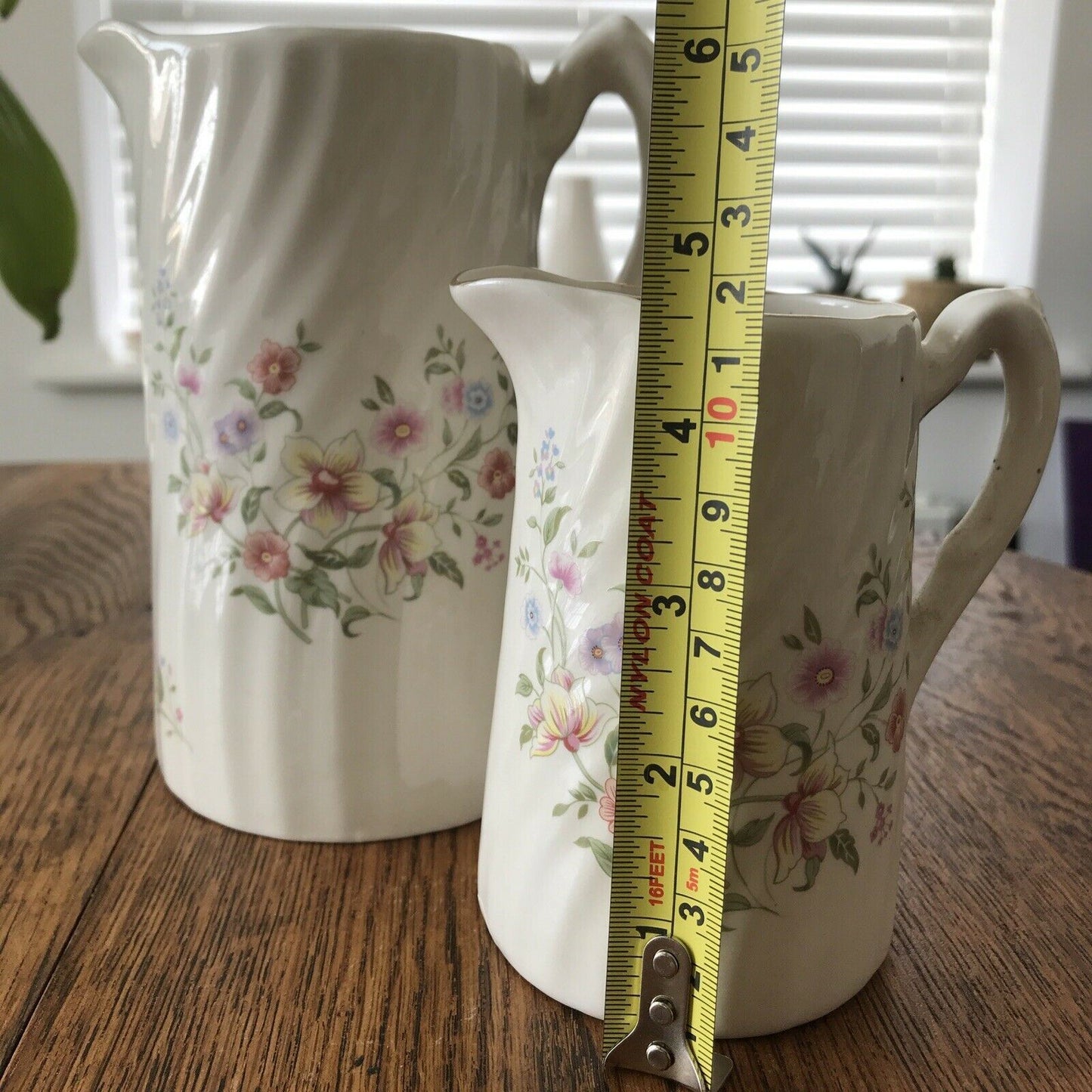 Pair Of Pretty Vintage Floral Jugs. Elegant. White With Pastel Flowers. Textured swirl design.