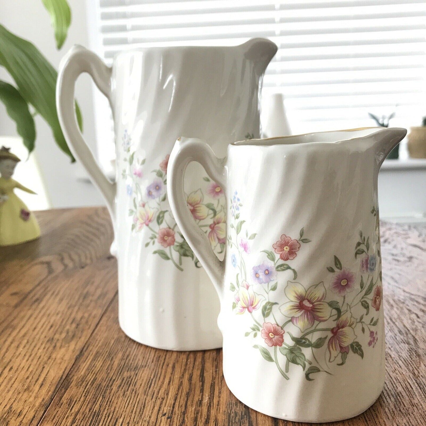 Pair Of Pretty Vintage Floral Jugs. Elegant. White With Pastel Flowers. Textured swirl design.