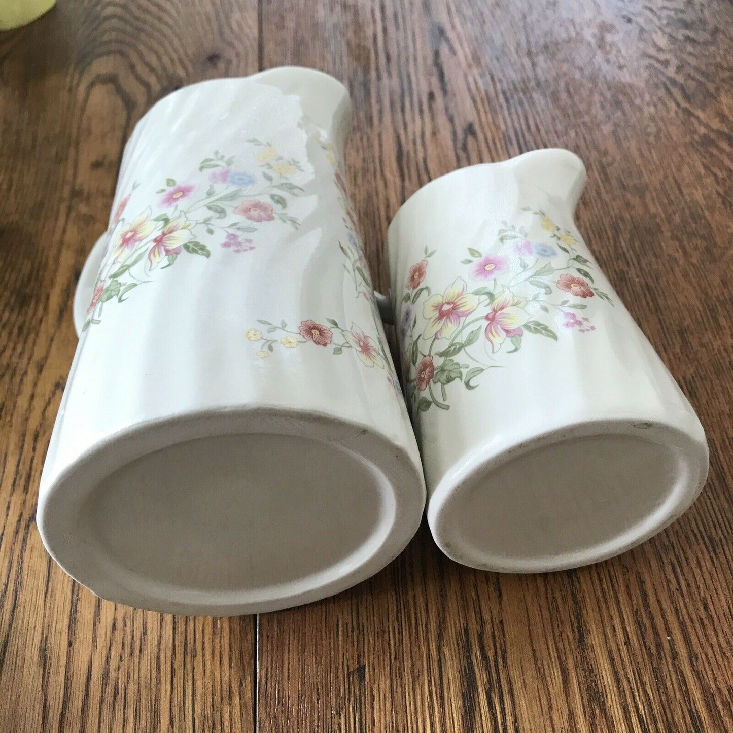 Pair Of Pretty Vintage Floral Jugs. Elegant. White With Pastel Flowers. Textured swirl design.