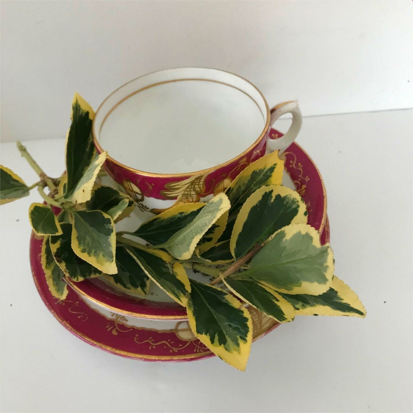 Beautiful bone china trio- cup, saucer, side plate. Deep pink & gold c.1920s Festive Christmas