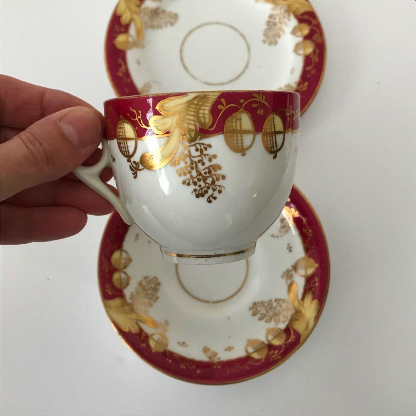 Beautiful bone china trio- cup, saucer, side plate. Deep pink & gold c.1920s Festive Christmas