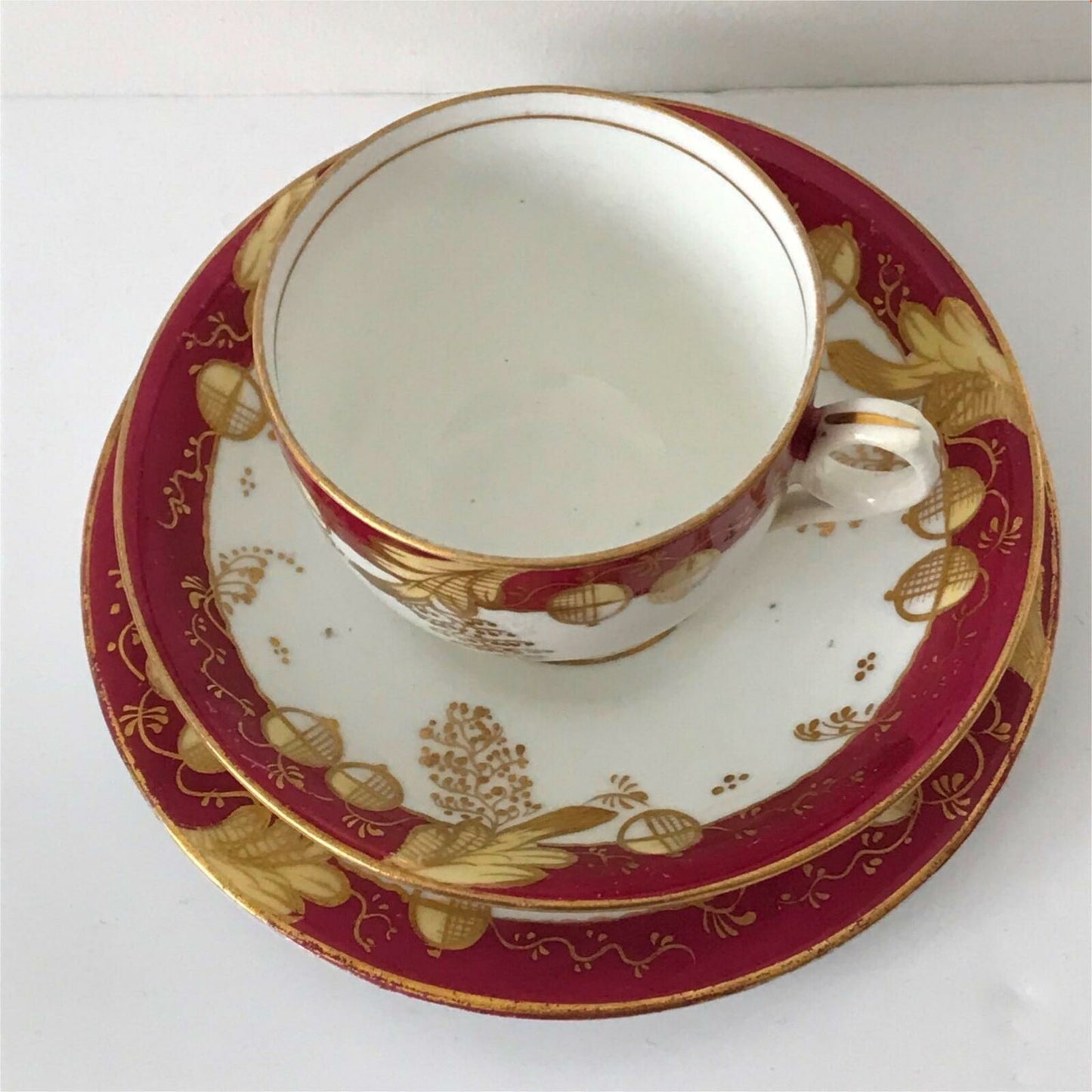 Beautiful bone china trio- cup, saucer, side plate. Deep pink & gold c.1920s Festive Christmas