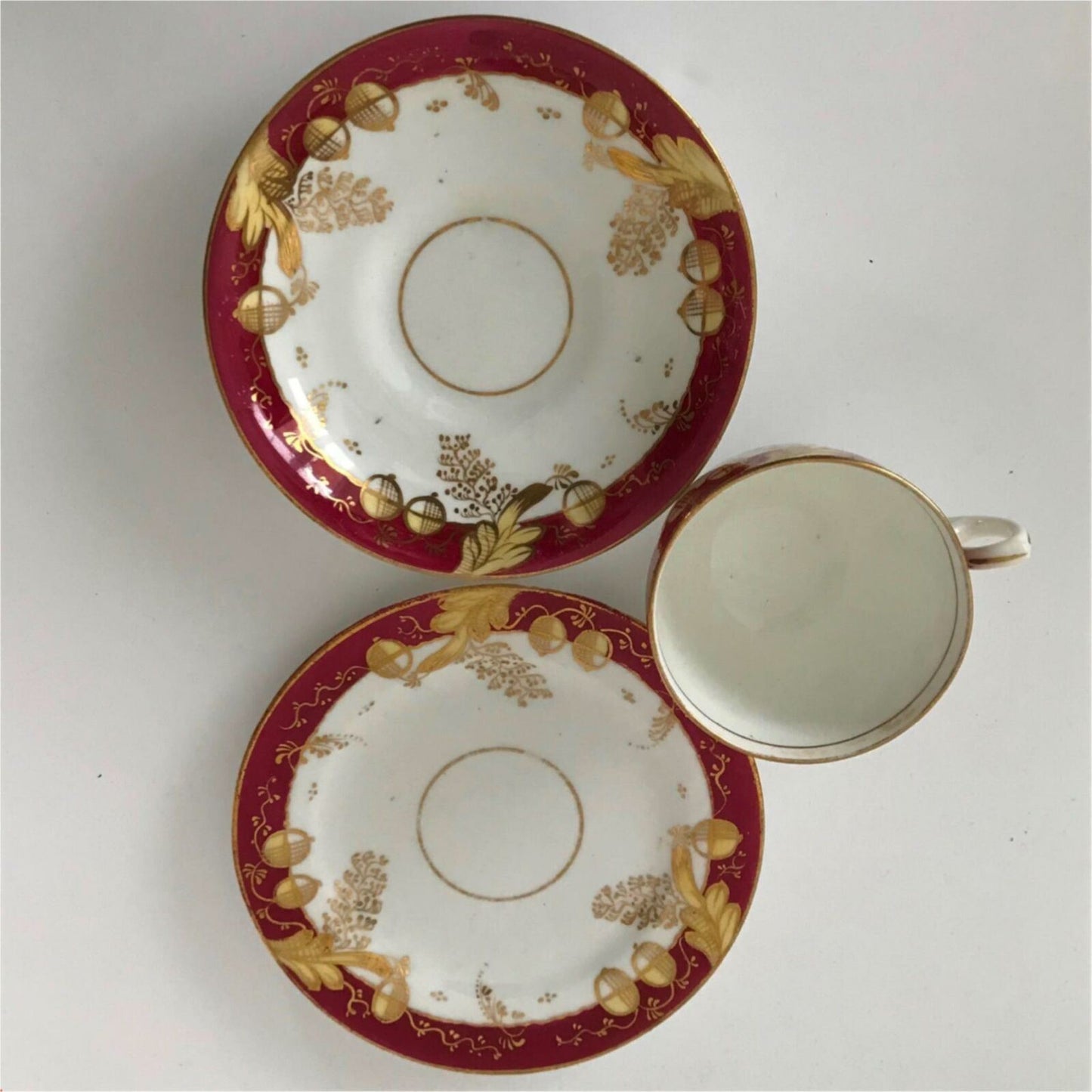 Beautiful bone china trio- cup, saucer, side plate. Deep pink & gold c.1920s Festive Christmas