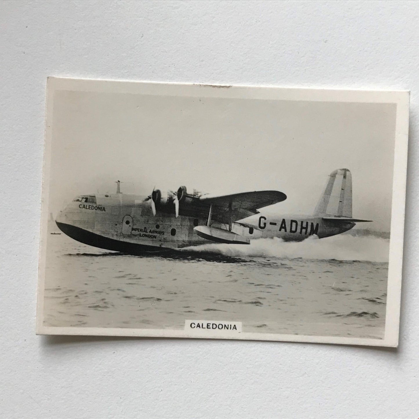 CALEDONIA Flying-boat Photocard Ardath Kings Tobacco card Topical Interest 1937